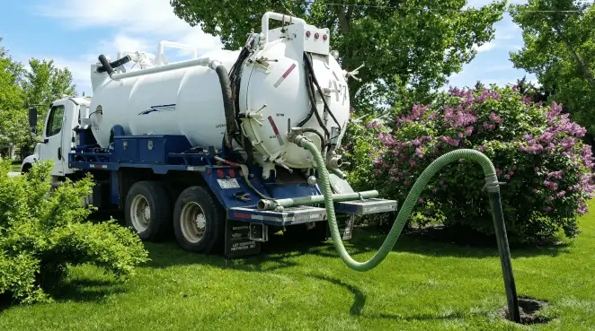 Professional vacuum truck performing residential drainage and septic maintenance in Jersey City, NJ